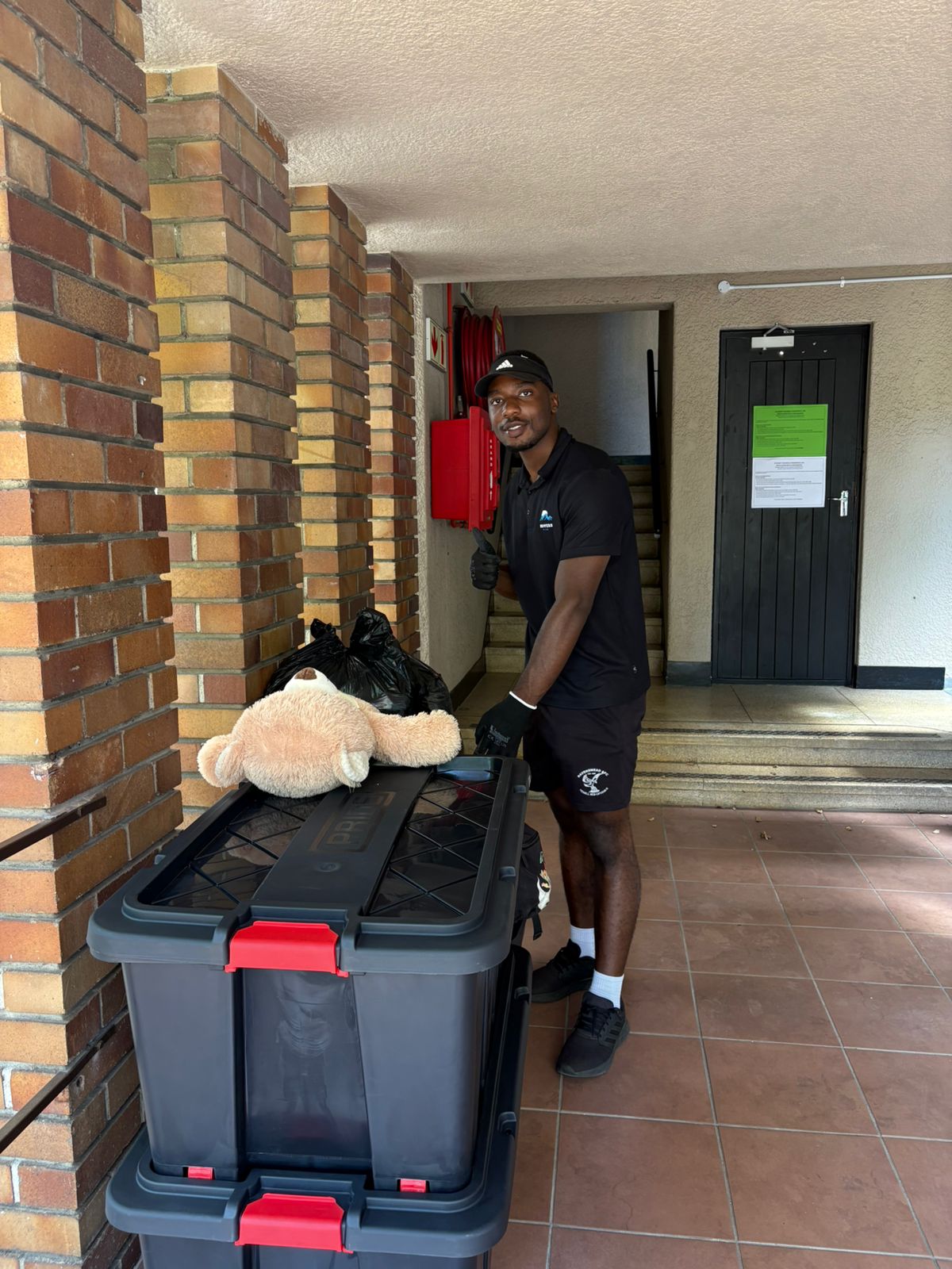 Movers carrying furniture into a new home